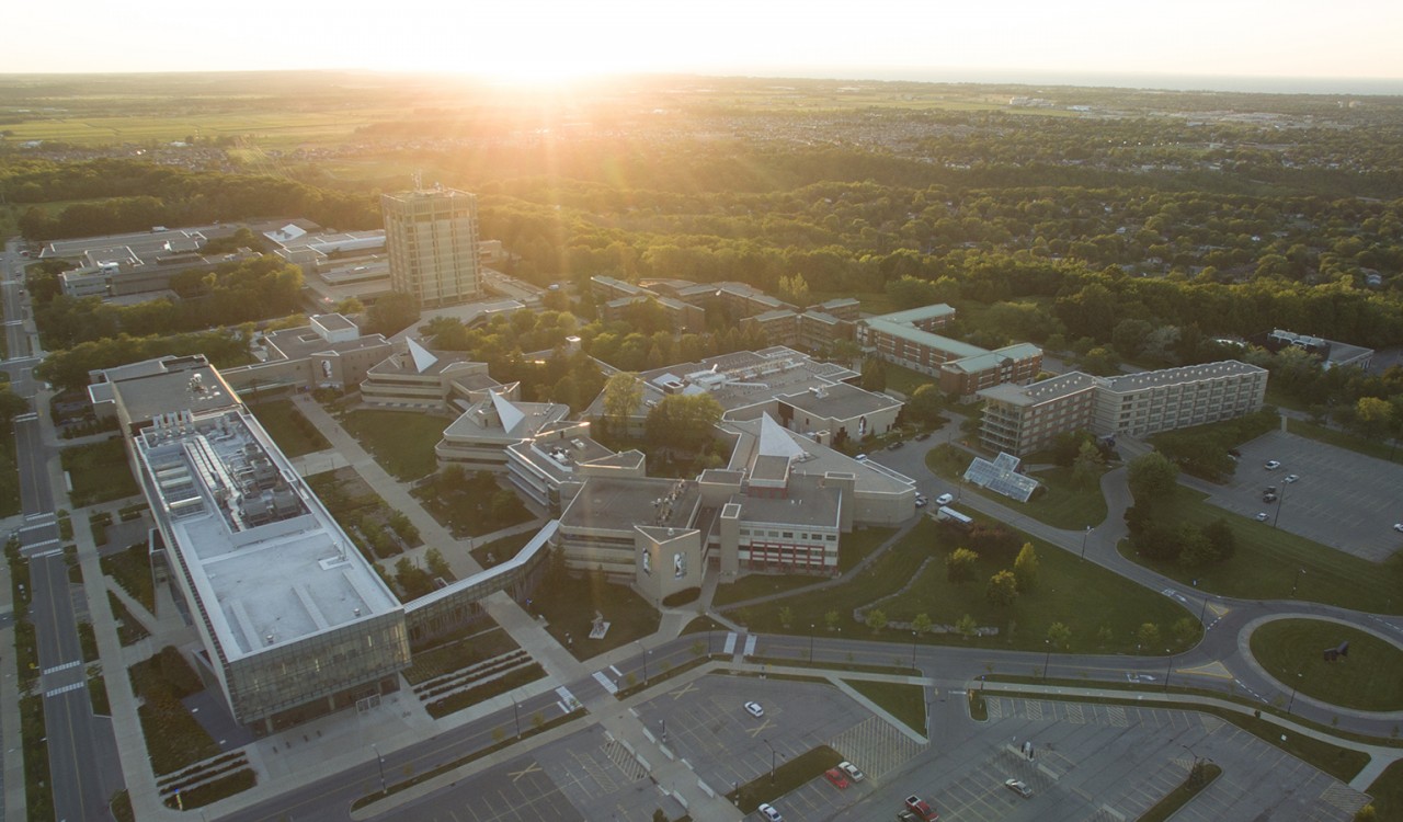 An aerial view of the Brock University campus at sunset.