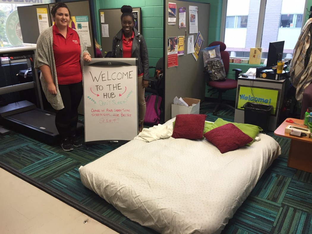 Students in front of a sign