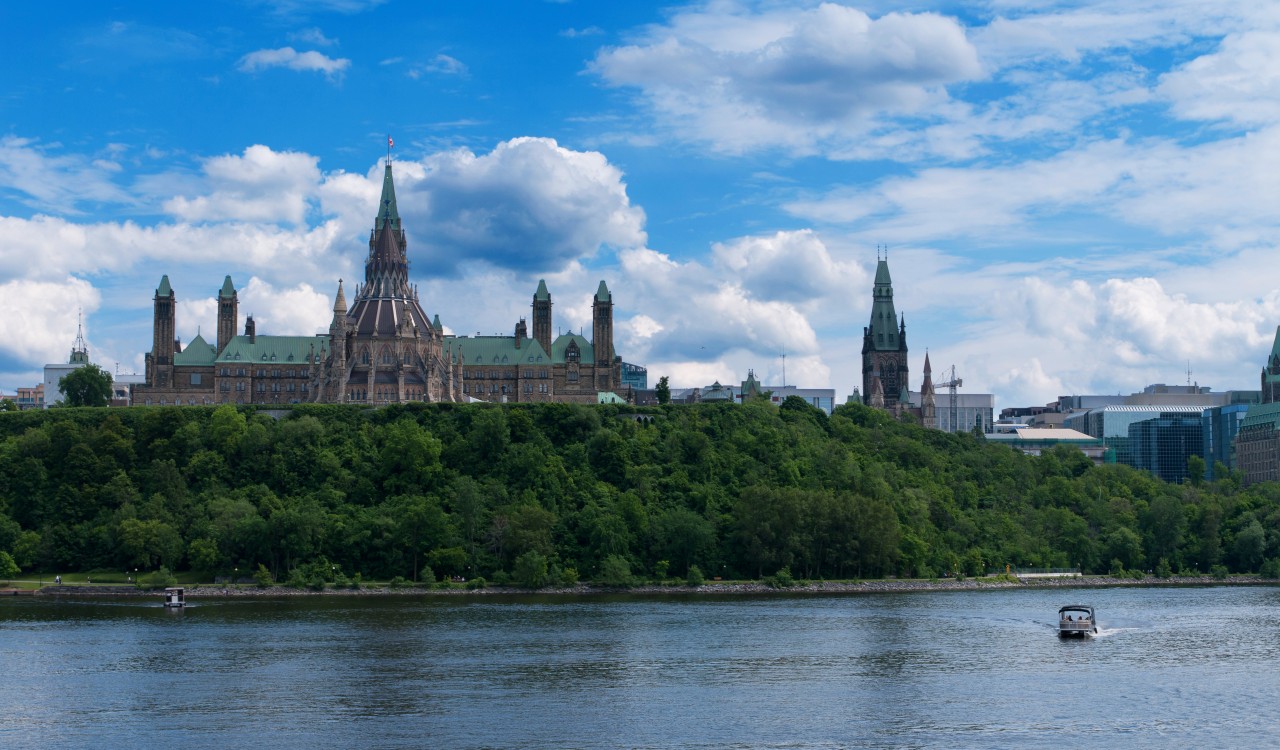 Canadian Parliament Hill viewed from across Ottawa River during a beautiful summer day