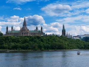 Canadian Parliament Hill viewed from across Ottawa River during a beautiful summer day