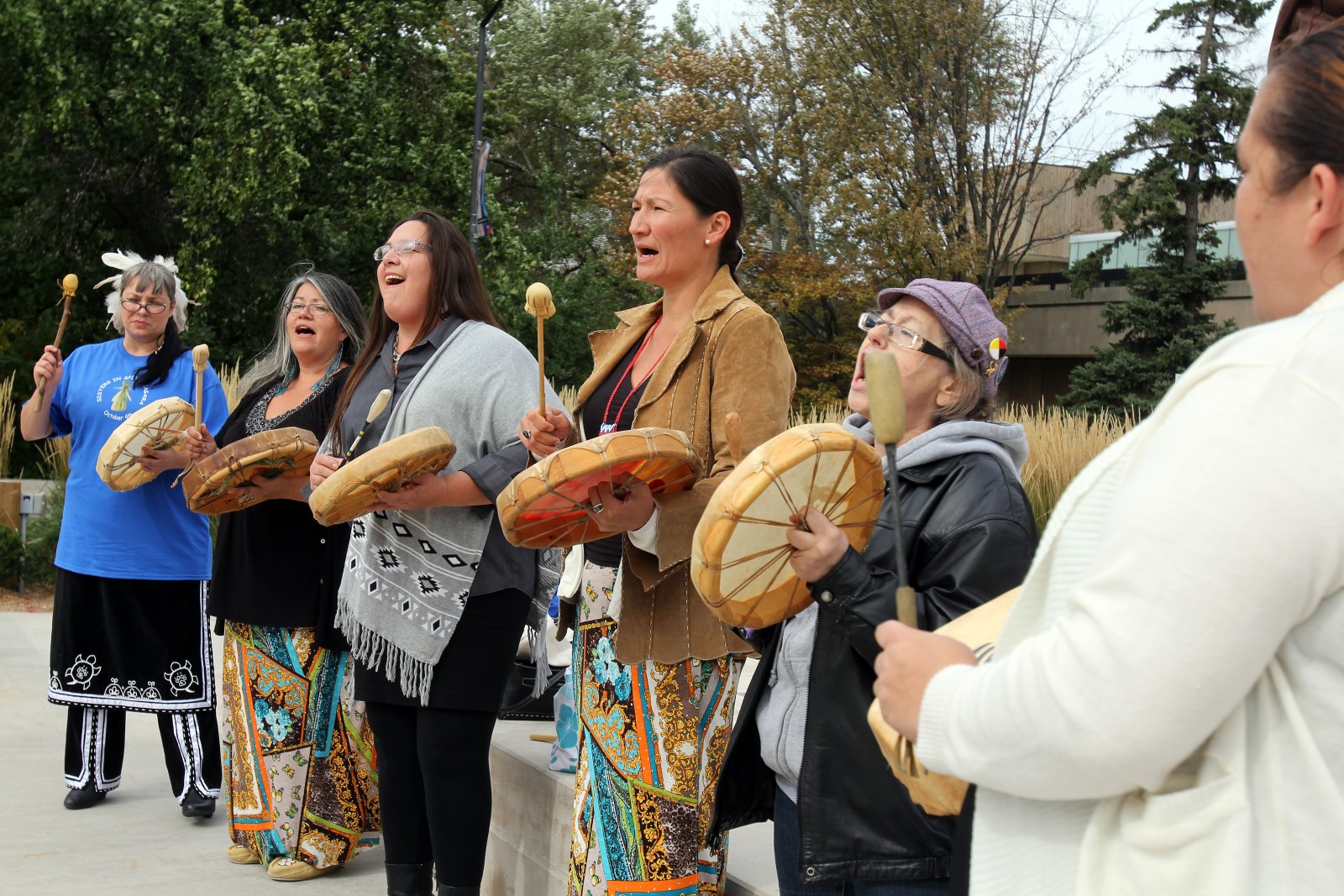 Women perform the Strong Women's Song Friday in front of the Brock statue during the Sisters in Spirit Vigil for Missing and Murdered Aboriginal Women and Girls.