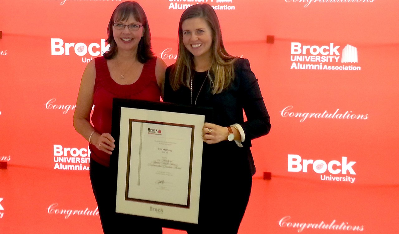 Erin Mathany, right, and her mother Janet pose for pictures after the Sport Management grad was awarded a 2015 Distinguished Alumni Award.