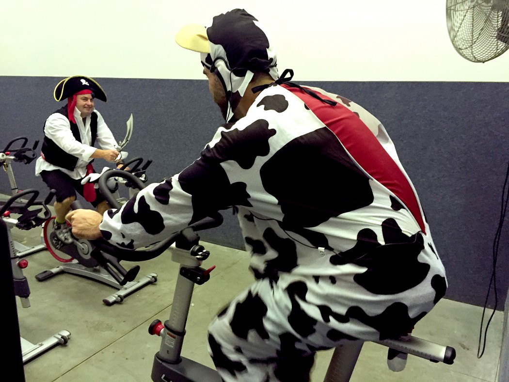 Eric Walter in the cow outfit and Karl Thorp in the pirate outfit at the United Way Spin-A-Thon.