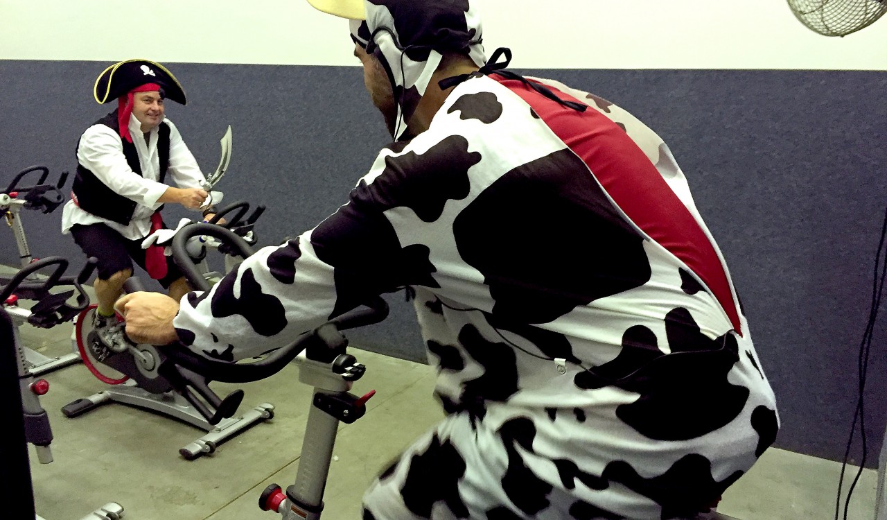 Eric Walter in the cow outfit and Karl Thorp in the pirate outfit at the United Way Spin-A-Thon.