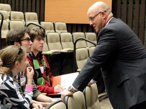 Brock University Vice-President of Finance and Administration Brian Hutchings talks to Grade 12 Eastdale Secondary School students Jenny Schaefer, Malcolm Allcorn and Luc Grenier, Oct. 14 during the Niagara Student Summit.