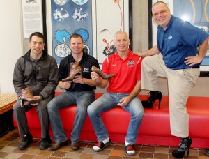 Brock University's Daniel Pozzobon, left, Curtis Gadula, Marty Calder and Kevin Lawr have their heels ready for Saturday's Walk a Mile in Her Shoes fundraiser for Gillian's Place. The team is looking for more walkers to participate in the event, which raises money for the women's shelter in St. Catharines.