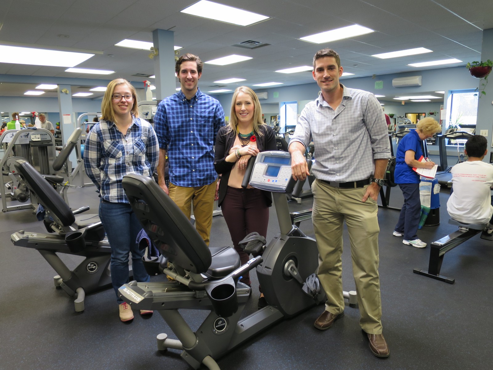 Students in front of an exercise machine