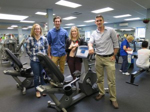 Students in front of an exercise machine