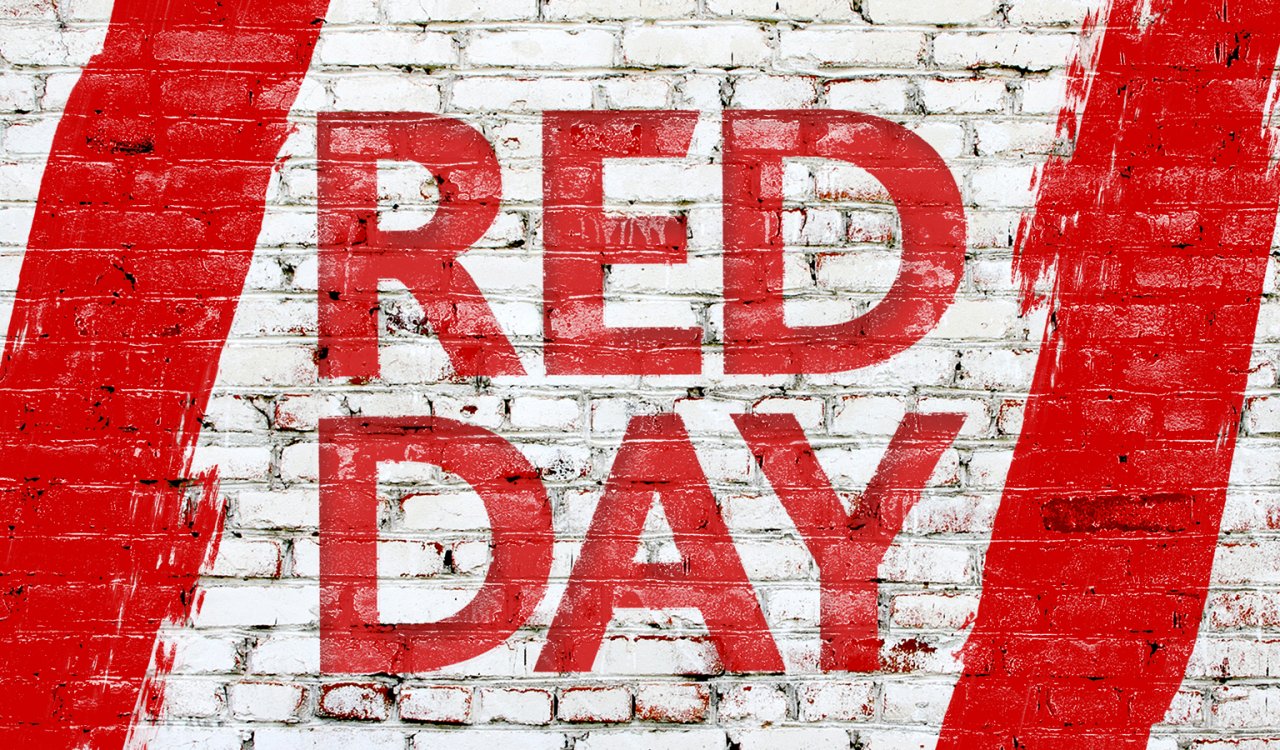 Brick wall with the words "Red Day" in red paint.