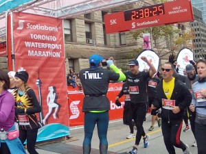 Robert MacDonald crosses the finish line in the Scotiabank half-marathon in Toronto.