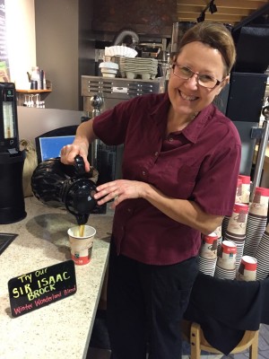 Beverly French pours a cup of the Sir Isaac Brock Winter Wonderland coffee in Guernsey Market.