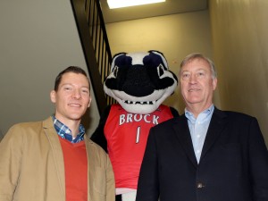 Brock University Provost and Vice-President, Academic, Neil McCartney, right, Boomer the Badger and Interim University Librarian Jonathan Younker in the library stairs to promote the #LibraryStairsChallenge.