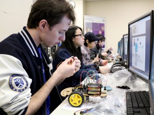 Adam Balint, a fourth-year computer science student taking part in the Brock University Design Studio (BUDS) program, works on the Brock/IBM Arduino Project, which will see IBM distribute an autonomous rover to Grade 8 students.