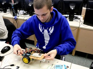 Zachary Cervone, a third-year interactive arts and science student, works on a rover as part of the BUDS program, which has partnered with IBM.