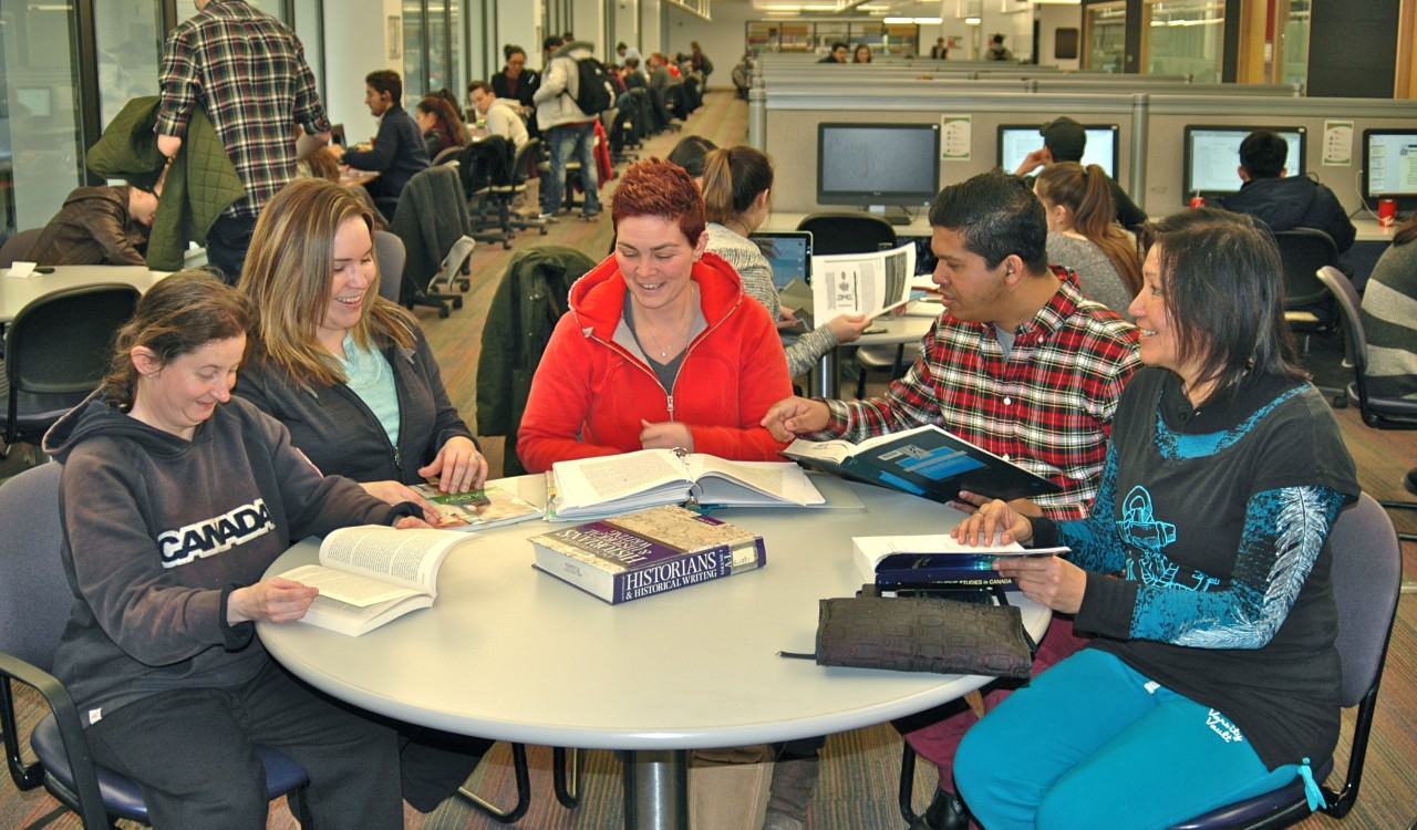 Hitting the books in Brock's Matheson Learning Commons: From left, Jennifer Nixon, Toronto (Mohawk nation) who is studying Film Studies; Jody General, Ohsweken (Mohawk), in Business Administration; Terra Wott, St Catharines (Mi'kmaq), double major honours Psychology and Women’s and Gender Studies; Ryan H. Wijesirigunawardenae, Niagara (Dene), Medical Sciences with minors in Labour Studies, Biology, Physics; and Beverly Bannon, Anemki-wajiw (Thunder Mountain) (Ojibway), Master’s in Education Curriculum Development with minor in Aboriginal Studies.