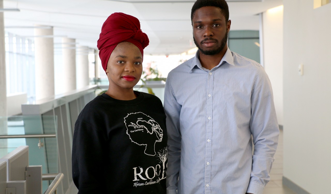 Merveilles Tshisuaka, left, and Francis Akpotu, public relations officers with the ROOTS African Caribbean Society.
