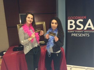Goodman Business Student's Association members Olgo Coltova, left, and Ann Hanna sell tickets for the upcoming Goodman Formal.