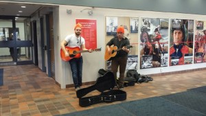 Two students do a little busking in the main foyer to raise money for the 5 Days for the Homeless campaign