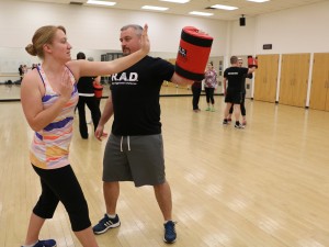 Rick Fraser, a Rape Aggression Defence trainer, works with Brock University student Adrienne Eby on defence techniques.