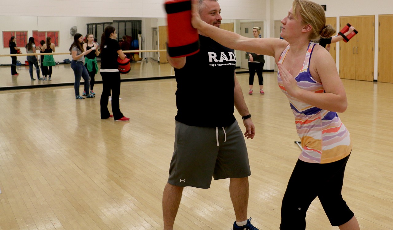 Rick Fraser, a Rape Aggression Defence trainer, works with Brock University student Adrienne Eby on defence techniques.