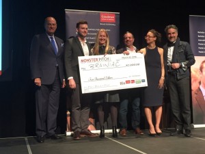 Judges Jim Treliving, Deborah Rosati, Jason Sparaga and Bruce Croxon present Harrison Olajos and Madi Fuller with the Monster Pitch grand prize for their business "Campus Brainiac"