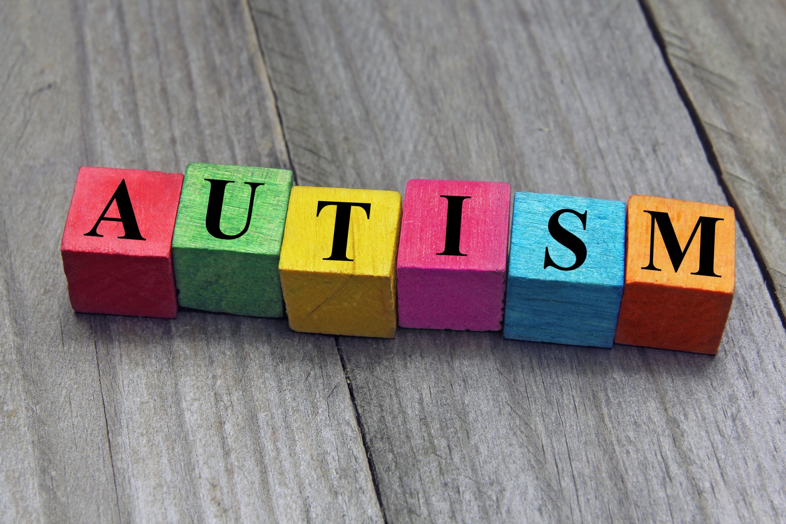 concept of autism word on wooden cubes