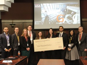 Mikayla Zolis (holding cheque on left), Gerda Kruckauskaite and Mohamad Hamade accept their Goodman Consulting Competition winnings from employer partners Christian Guirguis and Nathan Braun and Brock Golf Course owners Jen and Andrew Julie (left) and EY advisory manager Amena Mohammad and Goodman Consulting Office manager Glenn Stevens.