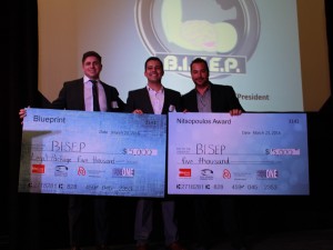 Blueprint winner Daniel Bordenave, middle, accepts cheques from Ryan Hayes of Fogler Rubinoff, LLP, left, and Tom Nitsopoulos of Heart of Niagara Hotels.