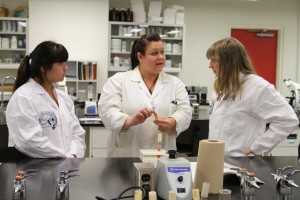 Students Nikki Choi and Amelia Coull learn about microbiology from senior lab demonstrator Christene Carpenter-Cleland