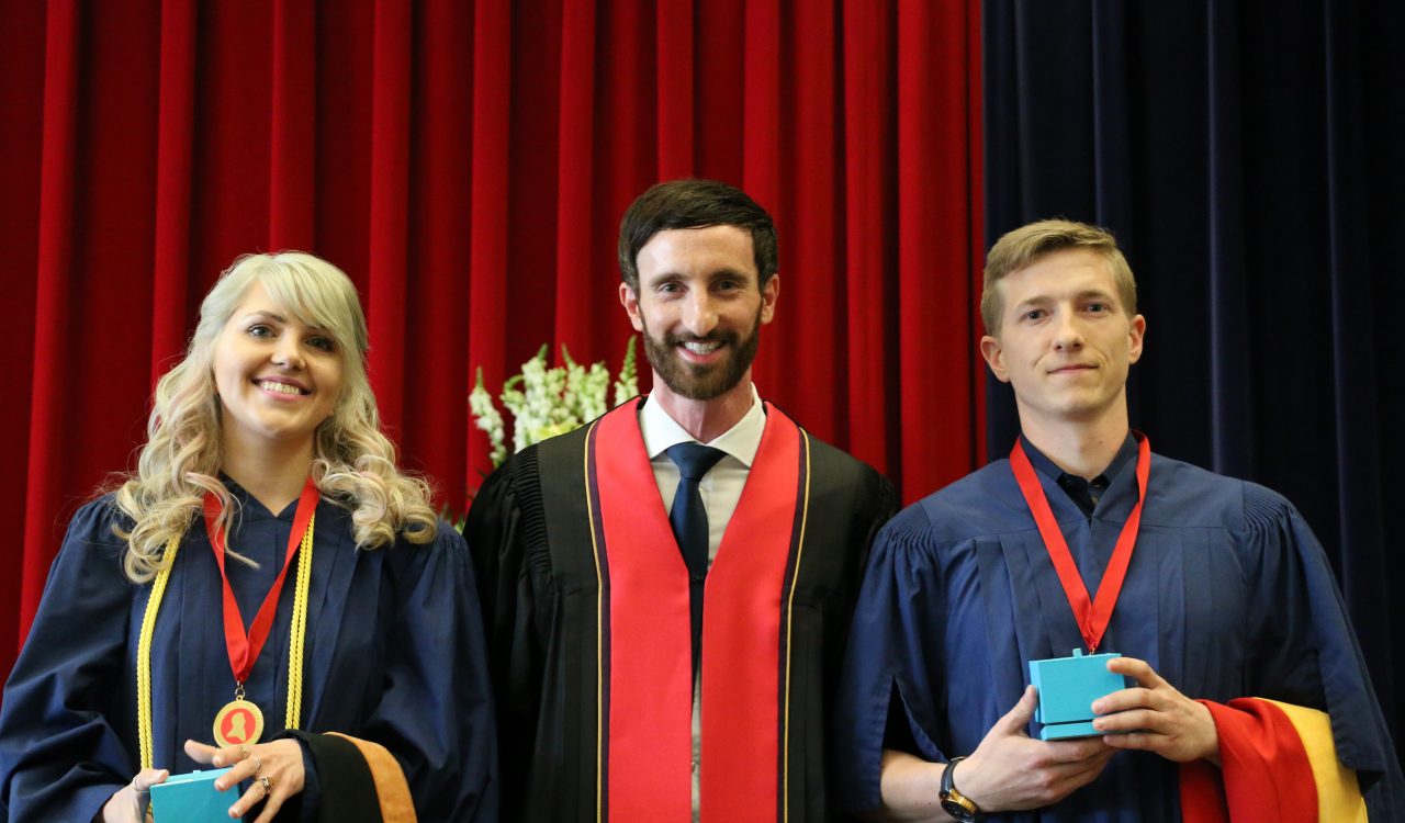 Mario De Divitiis, middle, presented the Board of Trustees Spirit of Brock awards to Kerri Ann Podwinski and Joshua Bowslaugh at Friday's Faculty of Applied Health Sciences afternoon convocation ceremony.