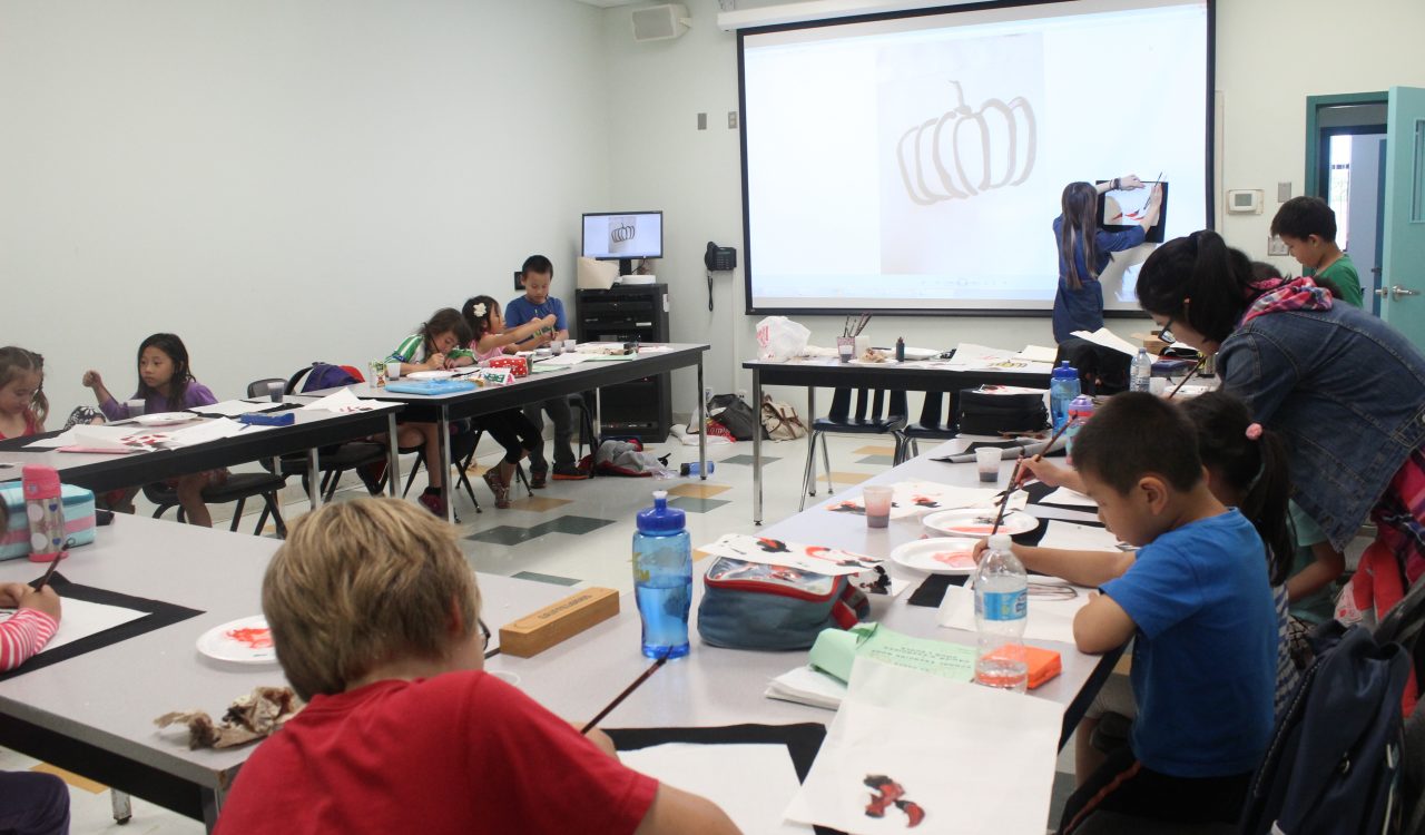 Participants in last year's Chinese language and culture summer camp makes crafts.