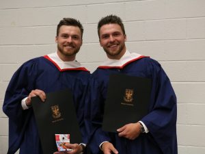 Twin brothers Colin Isnor, right, and Stuart Isnor, graduated Wednesday during the Faculty of Humanities convocation.