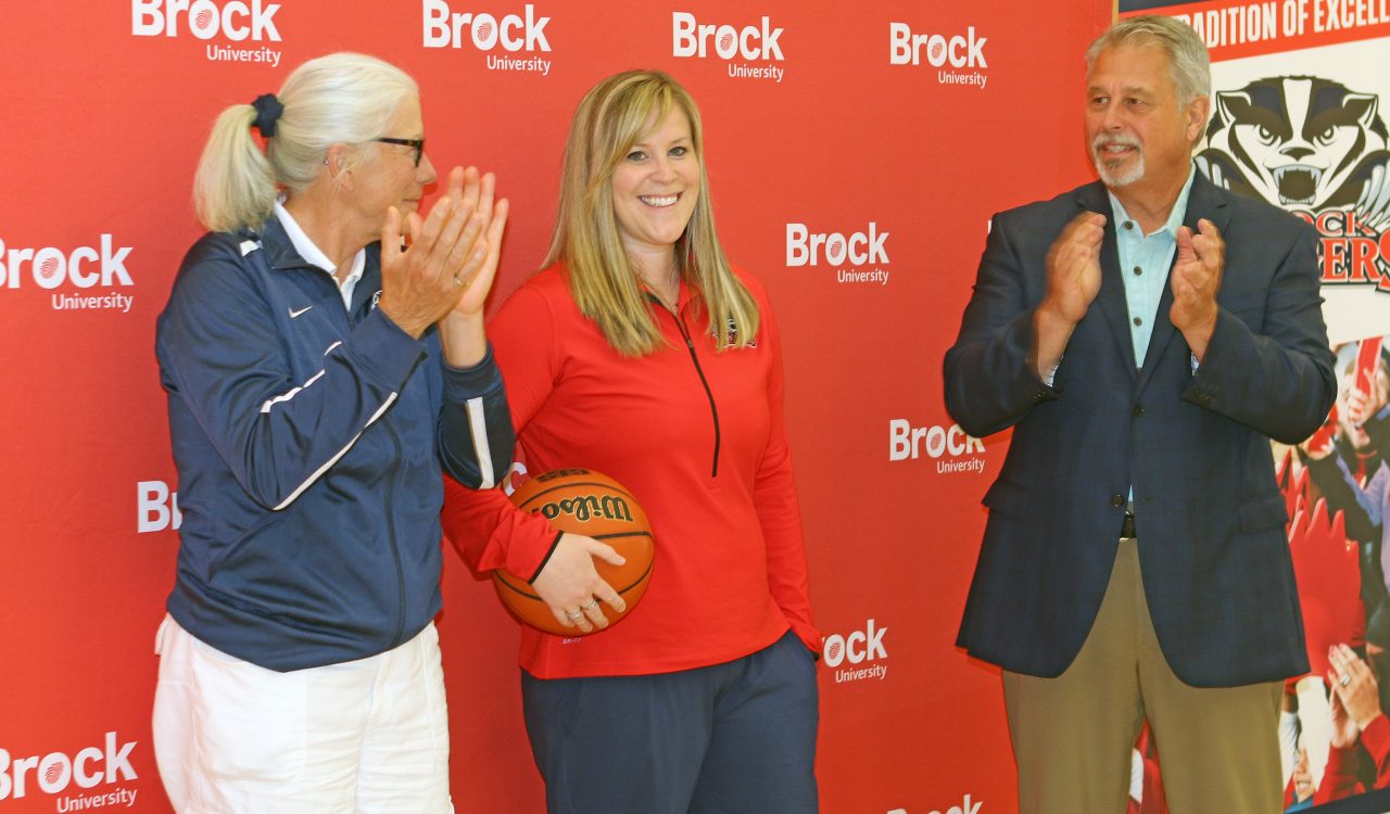 New Brock University women's basketball head coach Ashley MacSporran stands with Assistant Athletic Director Chris Critelli and Director of Athletics and Recreation Neil Lumsden Wednesday.