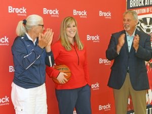New Brock University women's basketball head coach Ashley MacSporran stands with Assistant Athletic Director Chris Critelli and Director of Athletics and Recreation Neil Lumsden Wednesday.