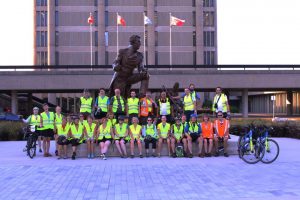Cyclists with Isaac Brock Statue