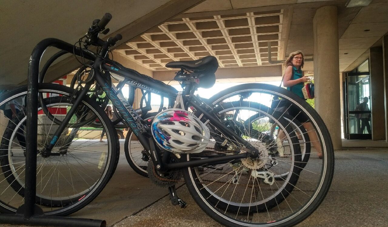 Bikes parked ion a rack under the Schmon Tower podium.