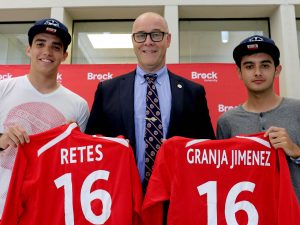 International Award for Possibilities recipients Eduardo Retes, left, and Alex Granja Jimenez, right, were presented with Brock jerseys from Acting President Brian Hutchings Thursday in Market Hall during a pro-sports style announcement event.