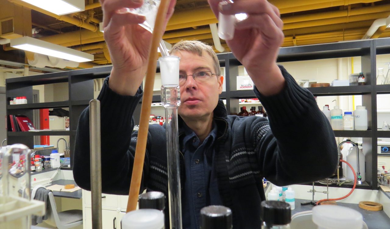 Travis Dudding in a chemistry lab