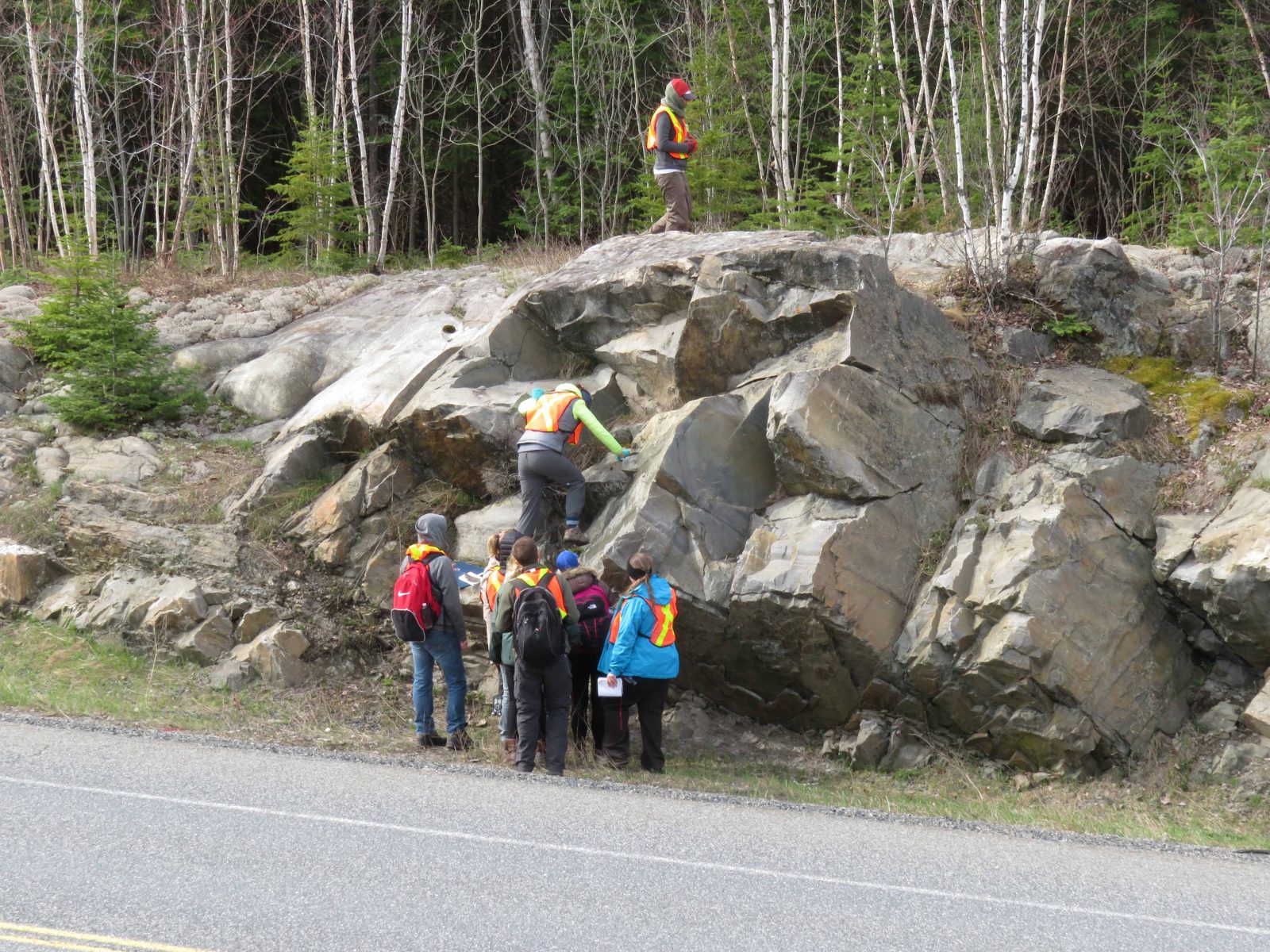 Students climbing rocks