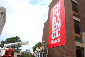 Experience brand banners being installed