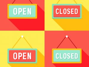 A series of four open and closed signs