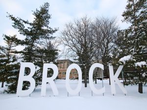 Large white Brock sign on the University's main campus