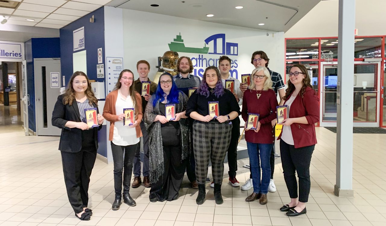 A group of students holding copies of The General.