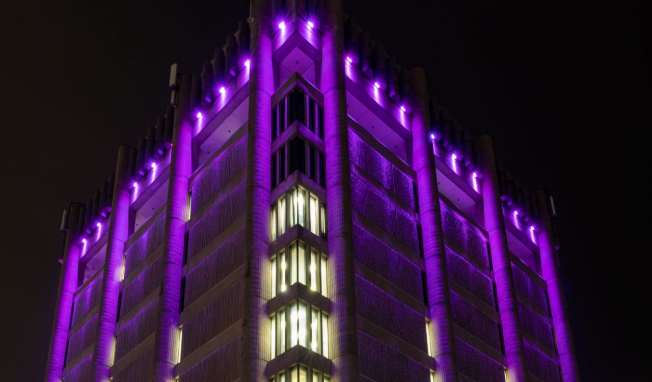 Brock University’s Arthur Schmon Tower lit in purple LED lights.