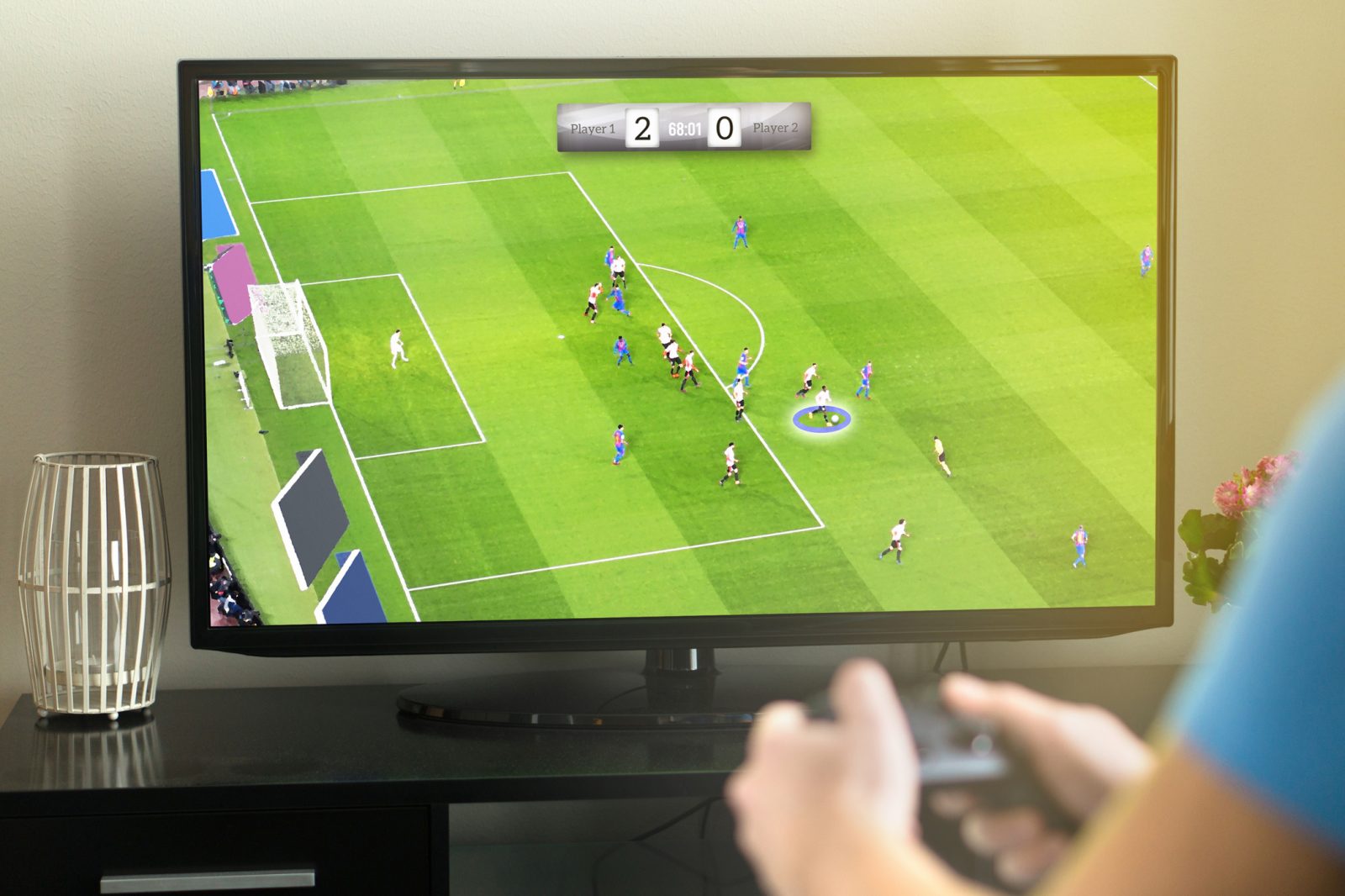 A tv screen displays virtual soccer players in the midst of a soccer game.