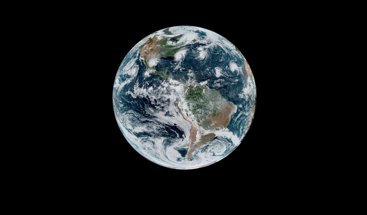 Earth seen from deep space with solid a black background.