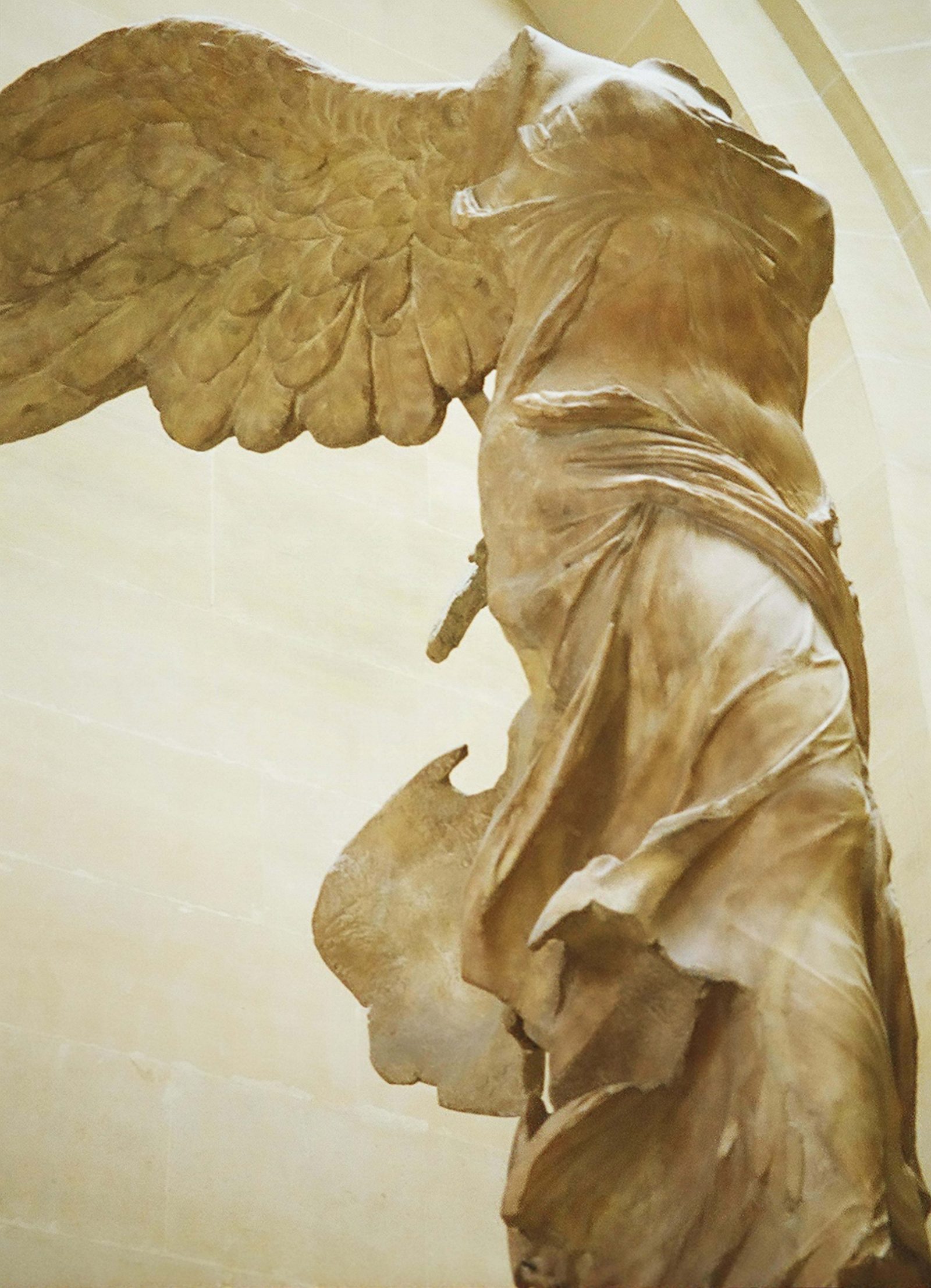 A winged sculpture of a woman.