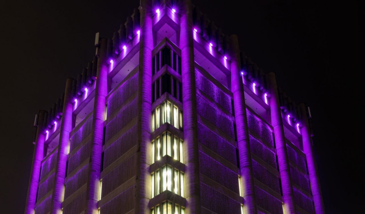 Brock University’s Arthur Schmon Tower lit in purple LED lights.