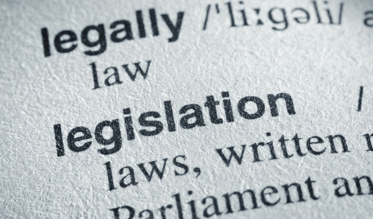 A dictionary page showing close-up of legislation definition with the words legislation and Parliament most prominent.