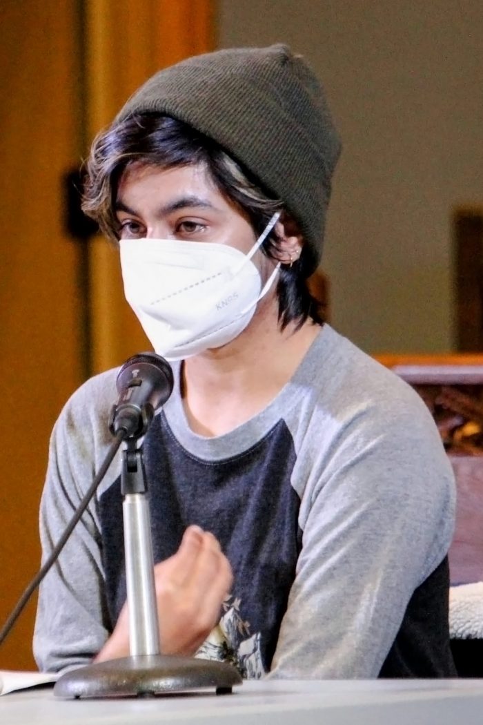 Hamnah Shahid, wearing a medical mask, speaks to the audience at the Silver Spire United Church.